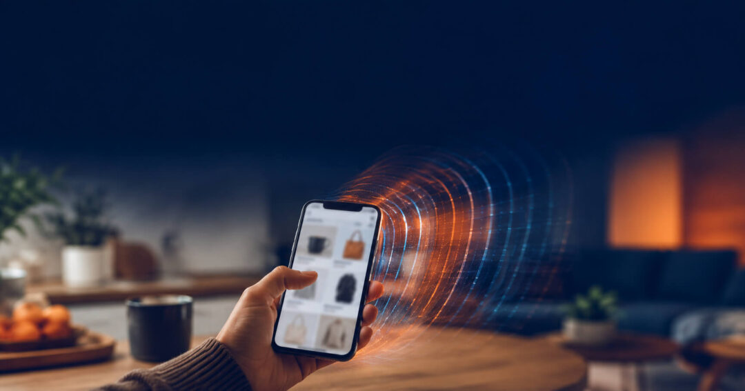 Hand holding a smartphone with a soft ripple effect radiating from the screen, representing this Google Display Network case study on view-through conversions and delayed purchase influence